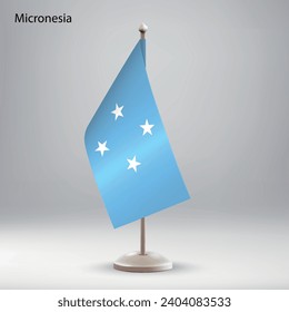 Flag of Micronesia hanging on a flag stand. Usable for summit or conference presentaiton