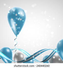 Flag of Micronesia on balloon. Celebration and gifts. Ribbon in the colors are twisted. Independence Day. Balloons on the feast of the national day. 