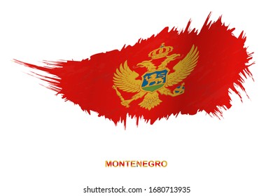 Flag of Montenegro in grunge style with waving effect, vector grunge brush stroke flag.