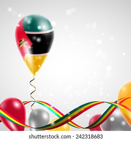 flag of Mozambique on balloon. Celebration and gifts. Ribbon in the colors are twisted. Balloons on the feast of the national day. 
