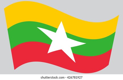 Flag of Myanmar waving on gray background