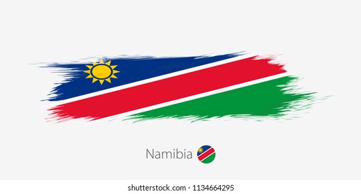Flag of Namibia, grunge abstract brush stroke on gray background. Vector illustration.