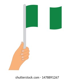 Flag of Nigeria  . Hand holding a Nigeria  flag - vector icon.