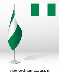 flag of NIGERIA on flagpole for registration of solemn event, meeting foreign guests. National independence day of NIGERIA. Realistic 3D vector on white