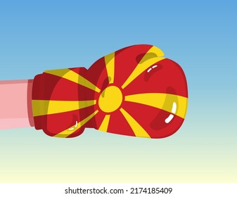 Flag of North Macedonia on boxing glove. Confrontation between countries with competitive power. Offensive attitude. Separation of power. Template ready design.