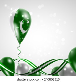 Flag of Pakistan on balloon. Celebration and gifts. Ribbon in the colors are twisted. Balloons on the feast of the national day. 