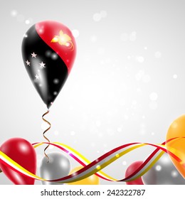 Flag of Papua - New Guinea on balloon. Celebration and gifts. Ribbon in the colors are twisted. Balloons on the feast of the national day. 