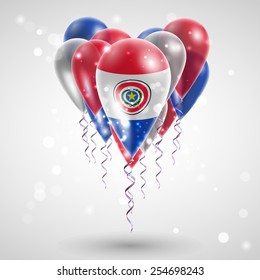 Flag of Paraguay on air balls in heart-shaped. Celebration and gifts. Ribbon in the colors are twisted under the balloon. Independence Day. Balloons on the feast of the national