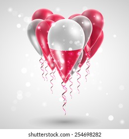 Flag of Poland on air balls in heart-shaped. Celebration and gifts. Ribbon in the colors are twisted under the balloon. Independence Day. Balloons on the feast of the national