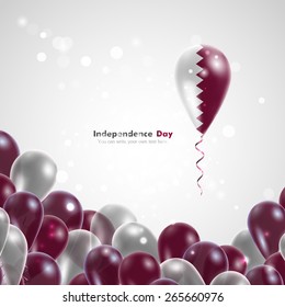 Flag of Qatar on balloon. Celebration and gifts. Ribbon in the colors are twisted. Independence Day. Balloons on the feast of the national
