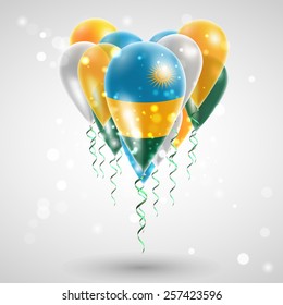 Flag of Rwanda on air balls in heart-shaped. Celebration and gifts. Ribbon in the colors are twisted under the balloon. Independence Day. Balloons on feast of the national