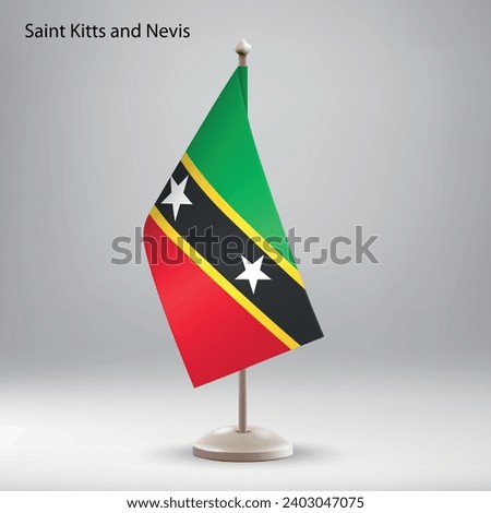 Flag of Saint Kitts and Nevis hanging on a flag stand. Usable for summit or conference presentaiton
