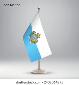 Flag of San Marino hanging on a flag stand. Usable for summit or conference presentaiton