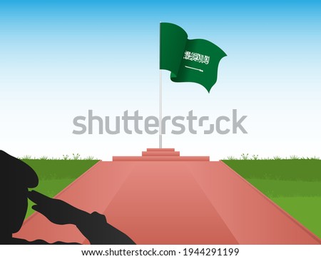 The flag of Saudi Arabia flies at the top of the pole in the image of a soldier saluting the flag