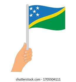 Flag of Solomon Islands. Hand holding a Solomon Islands flag - vector icon.