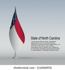 Flag of State of North Carolina (USA) hanging on a flagpole stands on the table. Vector illustration