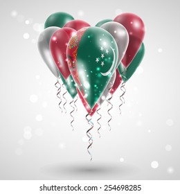 Flag of Turkmenistan on air balls in heart-shaped. Celebration and gifts. Ribbon in the colors are twisted under the balloon. Independence Day. Balloons on the feast of the national