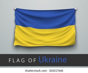 FLAG OF ukraine battered, hung on the wall, screwed screws