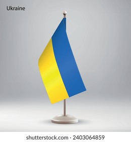 Flag of Ukraine hanging on a flag stand. Usable for summit or conference presentaiton