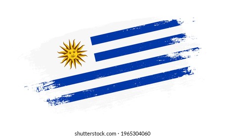 Flag of Uruguay country on brush paint stroke trail view. Elegant texture of national country flag