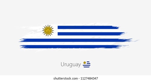 Flag of Uruguay, grunge abstract brush stroke on gray background. Vector illustration.