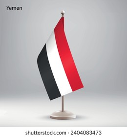 Flag of Yemen hanging on a flag stand. Usable for summit or conference presentaiton