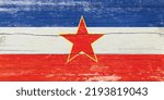 Flag of Yugoslavia on wooden background.Grungy Yugoslavia flag.