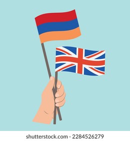 Flags of Armenia and UK, Hand Holding flags