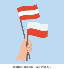 Banderas de Austria y Polonia, banderas con mano