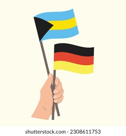 Flags of Bahamas and Germany, Hand Holding flags