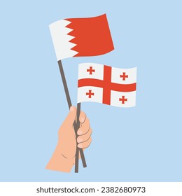 Flags of Bahrain and Georgia, Hand Holding flags
