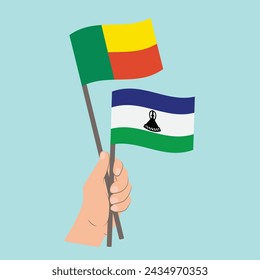 Fahnen von Benin und Lesotho, Hand halten Fahnen