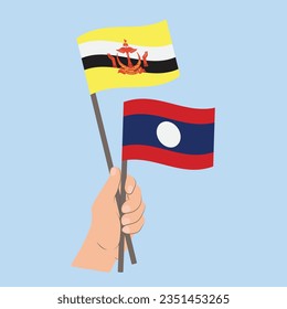 Banderas de Brunéi y Laos, mano con banderas