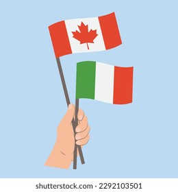 Banderas de Canadá e Italia, banderas con mano