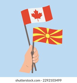 Flags of Canada and North Macedonia, Hand Holding flags