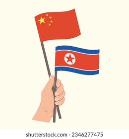 Flags of China and North Korea, Hand Holding flags