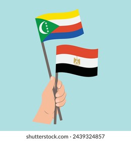 Flags of Comoros and Egypt, Hand Holding flags