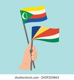 Flags of Comoros and Seychelles, Hand Holding flags
