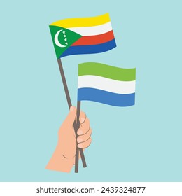 Flags of Comoros and Sierra Leone, Hand Holding flags