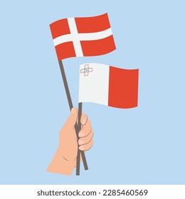 Banderas de Dinamarca y Malta, banderas con mano