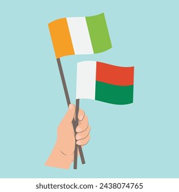 Flags of Côte d'Ivoire and Madagascar, Hand Holding flags