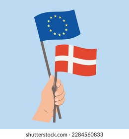 Flags of EU and Denmark, Hand Holding flags