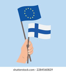 Flags of EU and Finland, Hand Holding flags