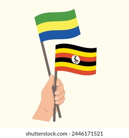 Flags of Gabon and Uganda, Hand Holding flags