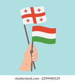 Flags of Georgia and Hungary, Hand Holding flags