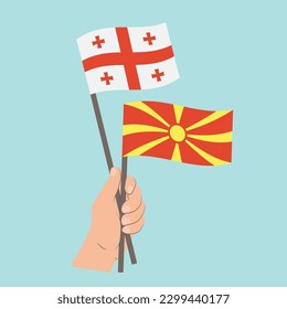 Flags of Georgia and North Macedonia, Hand Holding flags