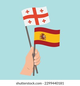 Flags of Georgia and Spain, Hand Holding flags