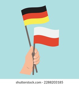 Flags of Germany and Poland, Hand Holding flags