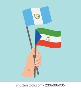 Banderas de Guatemala y Guinea Ecuatorial, con banderas de mano