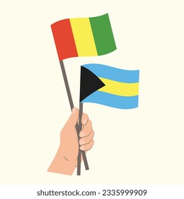 Flaggen von Guinea und Bahamas, handgeführte Flaggen